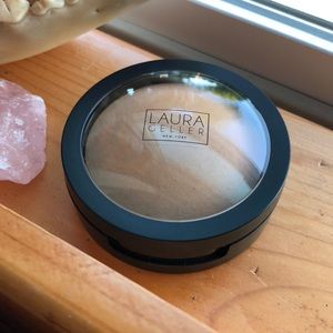 Laura Geller powder foundation in color “Sand”